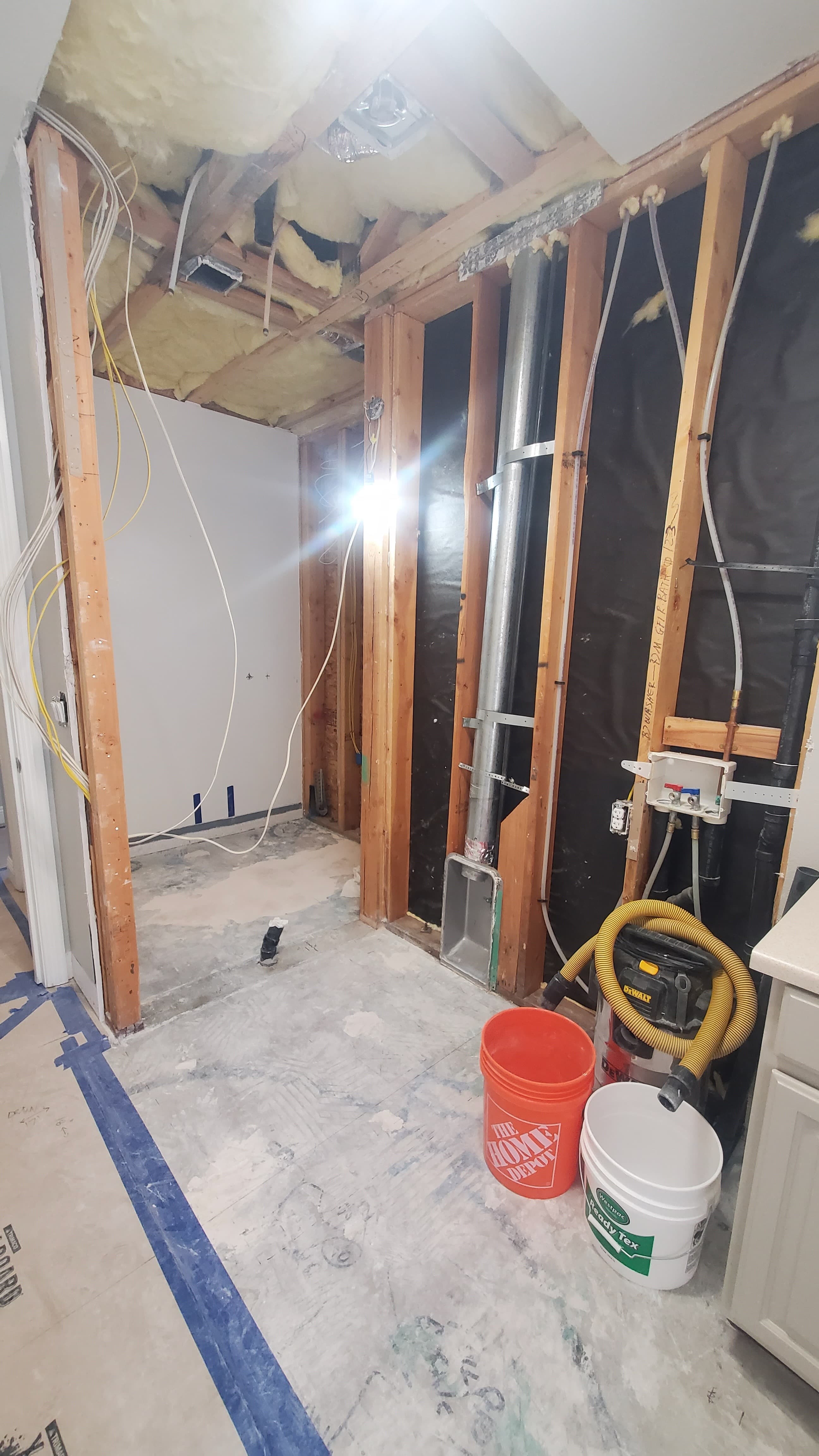 Framing, electrical, HVAC and plumbing visible during demo phase